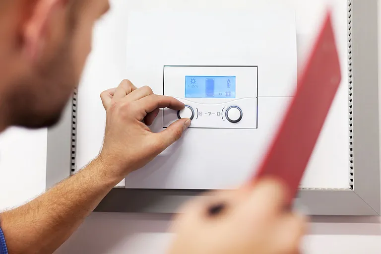 plumber installing a boiler