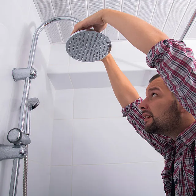 plumber fixing a shower