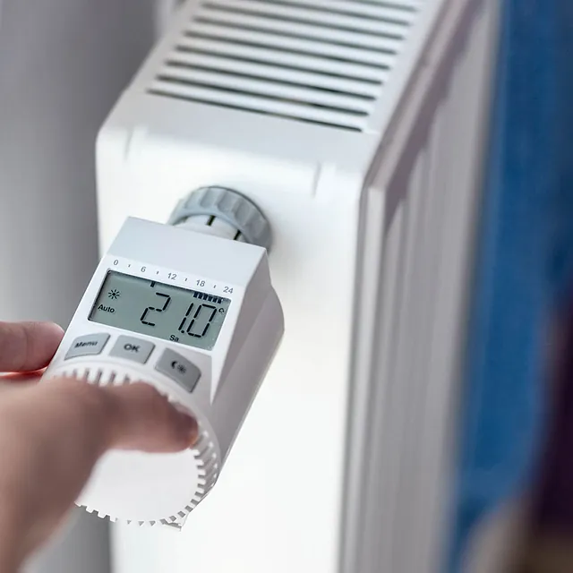 plumber testing a radiator